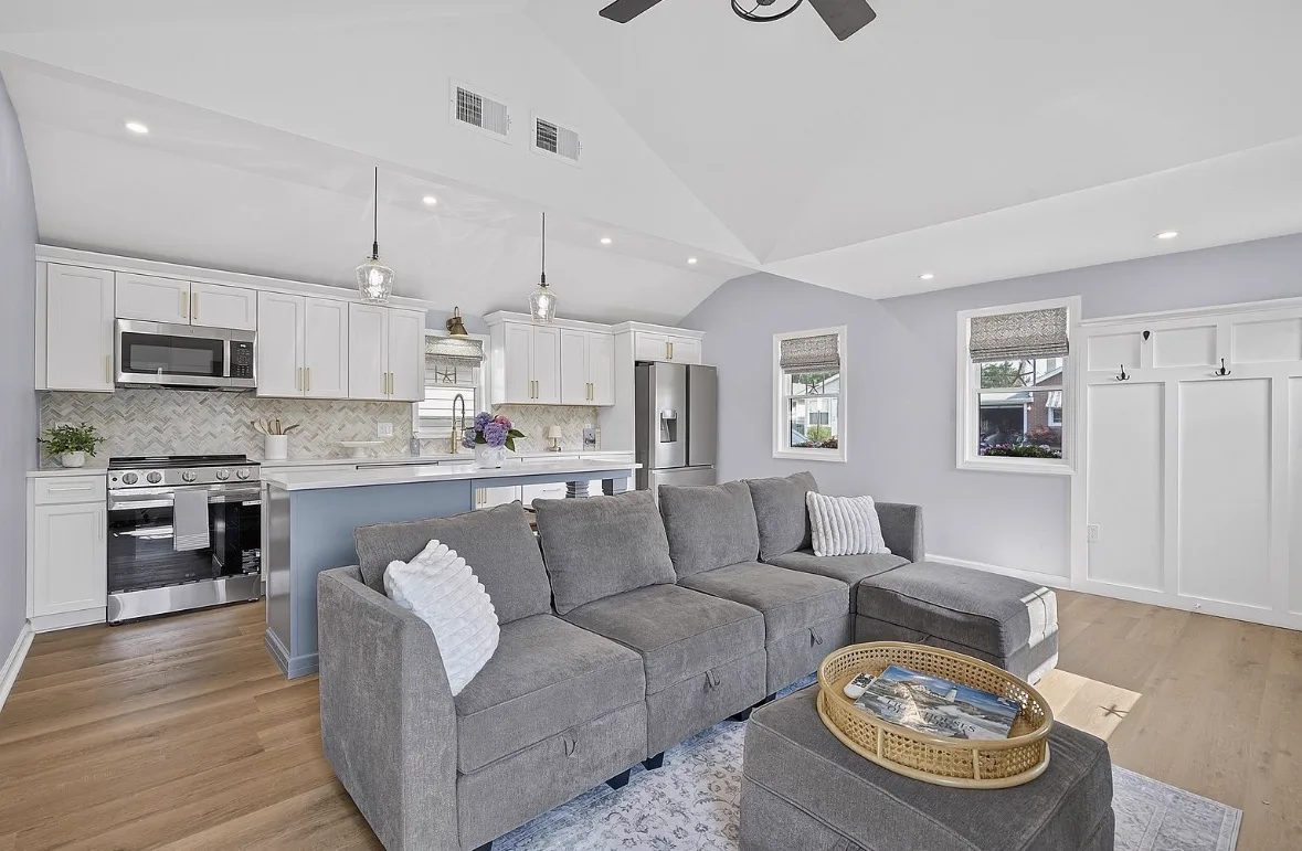 Sectional sofa facing the kitchen island at The Salted Cottage, Spring Lake NJ