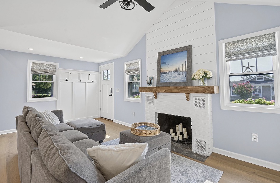 Living room with shiplap fireplace and reclaimed wood mantel
