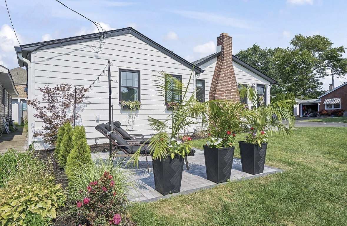 Side yard patio and brick chimney